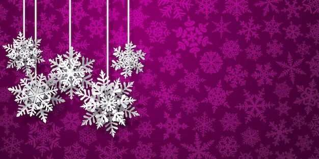 Christmas background of paper snowflakes with soft shadows white on purple background with falling snow