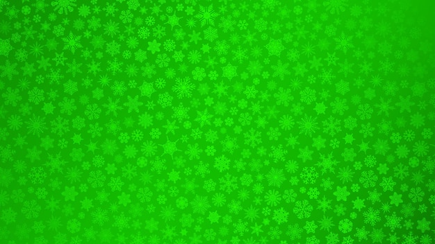 Christmas background of small snowflakes in green colors