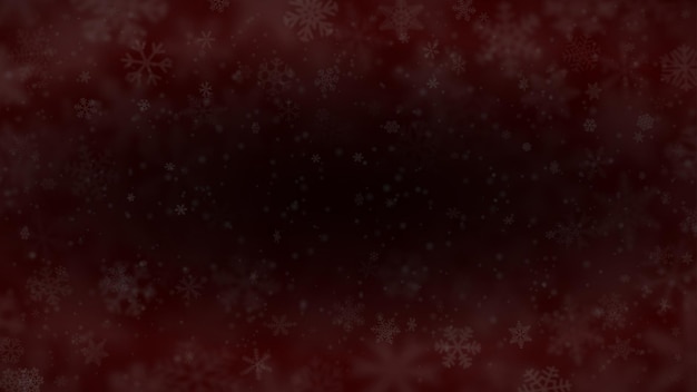 Christmas background of snowflakes of different shapes sizes blur and transparency in dark red colors