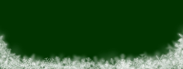 Christmas background of snowflakes of different shapes sizes blur and transparency on green background