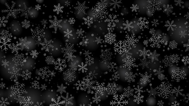 Christmas background of snowflakes of different shapes sizes and transparency in gray and black colors