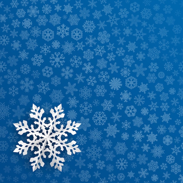 Christmas background with snowflake cut out of paper on blue background of small snowflakes