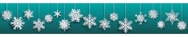 Christmas banner of large white complex paper hanging snowflakes on turquoise background