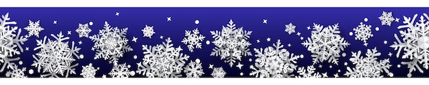 Christmas banner of paper snowflakes with soft shadows white on blue background With seamless horizontal repetition