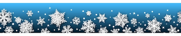 Christmas banner of paper snowflakes with soft shadows, white on light blue background. With seamless horizontal repetition