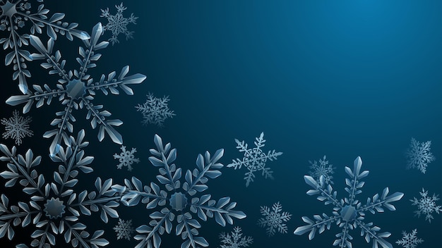 Christmas composition of large complex transparent snowflakes in light blue colors on dark gradient background