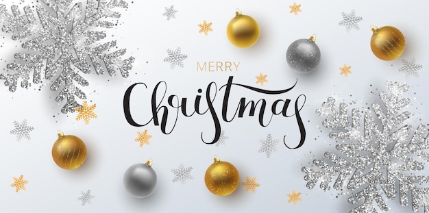 Christmas greeting card, web banner, background.Gold and silver Christmas ball, with an ornament and spangles. Metallic gold and silver Christmas snowflake. Hand drawn lettering