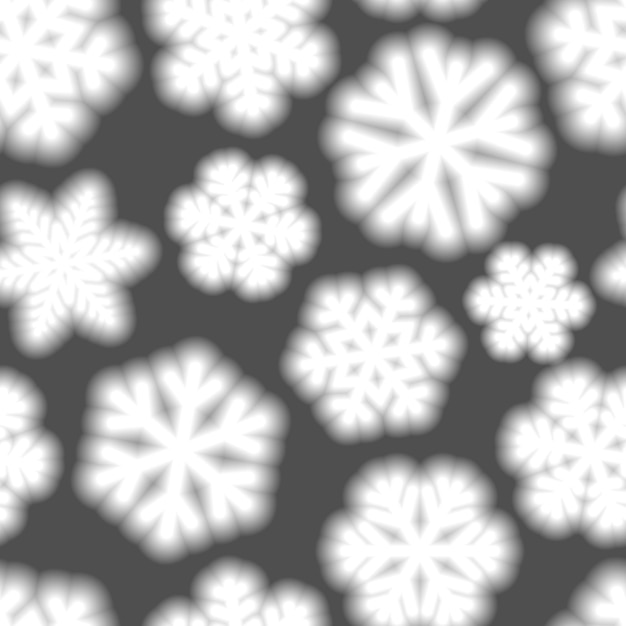 Christmas seamless pattern of big blurry snowflakes white on gray background