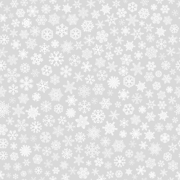 Christmas seamless pattern of small snowflakes, white on gray