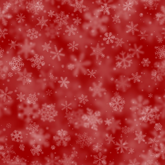 Christmas seamless pattern of snowflakes of different shapes sizes blur and transparency on red background