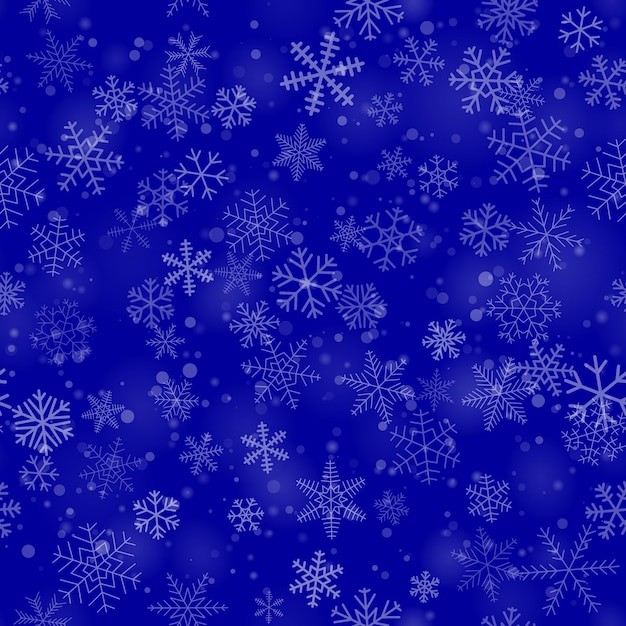 Christmas seamless pattern of snowflakes of different shapes sizes and transparency on blue background