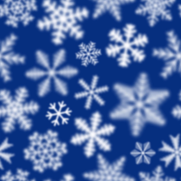 Christmas seamless pattern of white defocused snowflakes on blue background