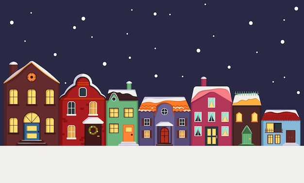 City street of bright multicoloured houses with roof covered in snow