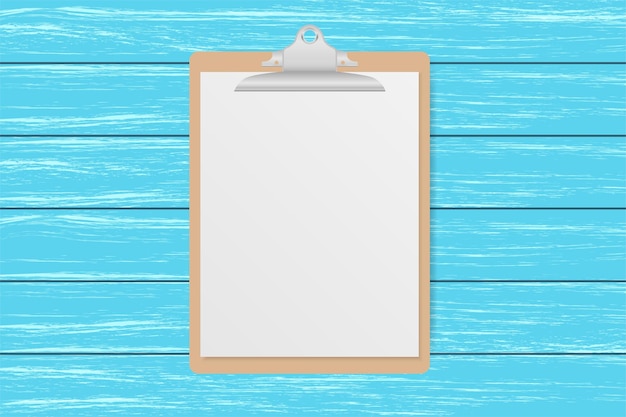 Clipboard with white sheet on old blue wooden background