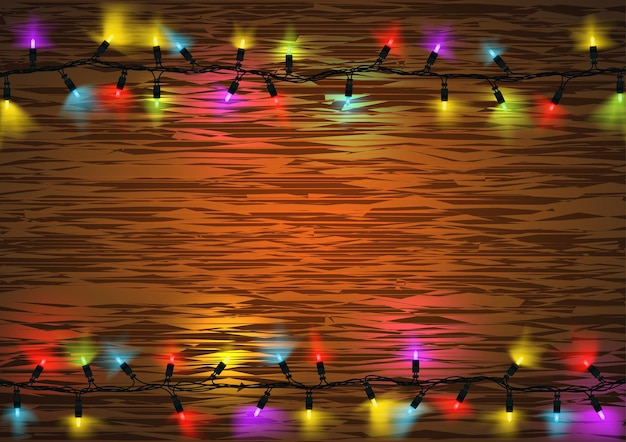 Colorful Christmas LED Lights with Glowing Effect over Wood Background