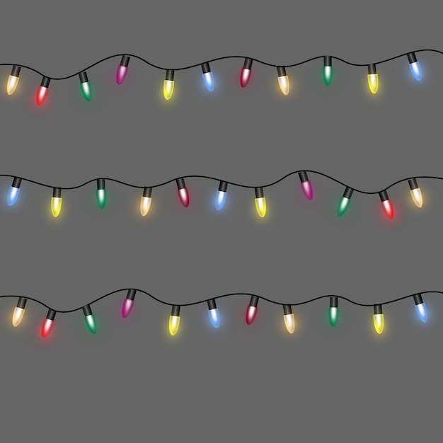 Colorful Christmas lights on wooden background