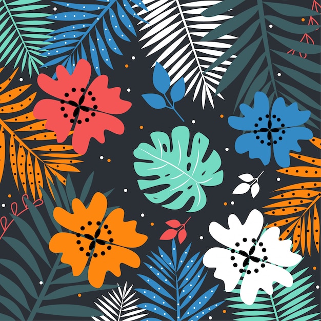 Colorful tropical leaves on dark background