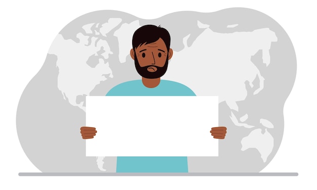 The concept of world attention A man holds a white poster in his hands against the background of a world map