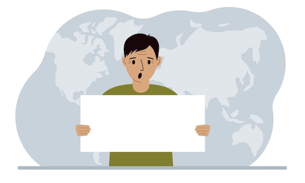 The concept of world attention A man holds a white poster in his hands against the background of a world map