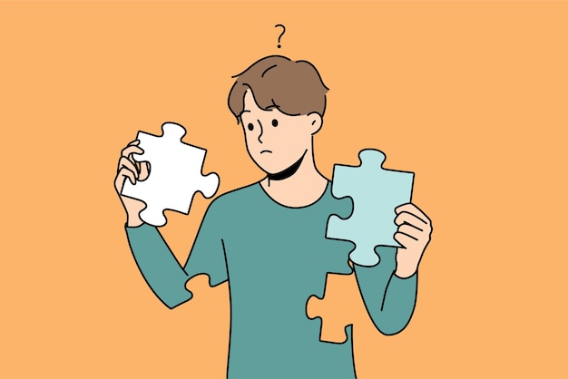 Confused man with puzzles in hands rebuild personality