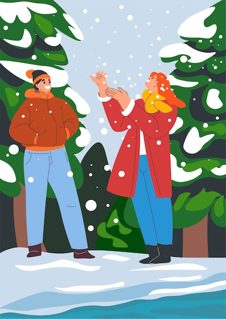 Couple enjoying first snow in winter man and woman