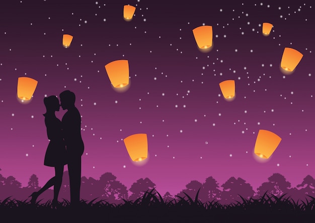 Couple hug together and kiss lantern above