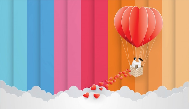 Couple in red balloon on  the color sky background.