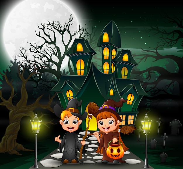 Couple witch in front of the haunted house 