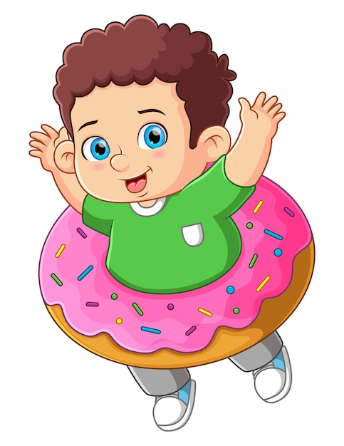 A cute boy playing with a big strawberry donut toy