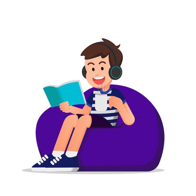 cute boy reading a book and using a headset while sitting on a beanbag