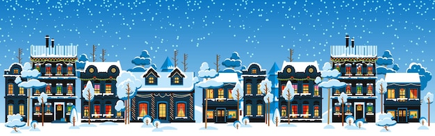 Cute christmas and winter houses snowy night in cozy christmas town panorama