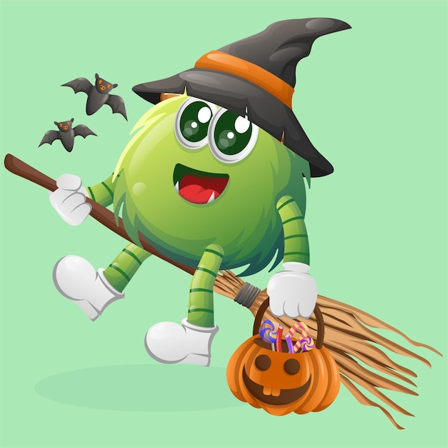 Cute green monster witch with holding halloween pumpkin