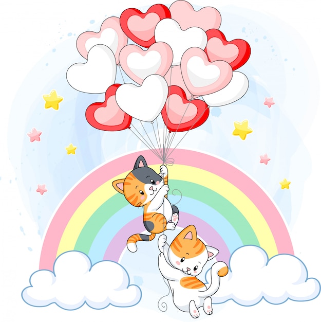 Cute kittens playing together with heart air balloons