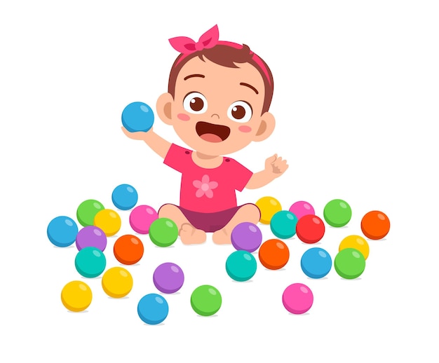 Cute little baby girl playing with colorful balls