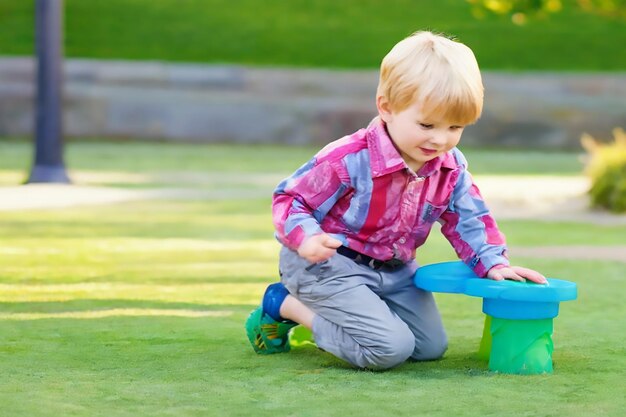 Vector cute little boy playing