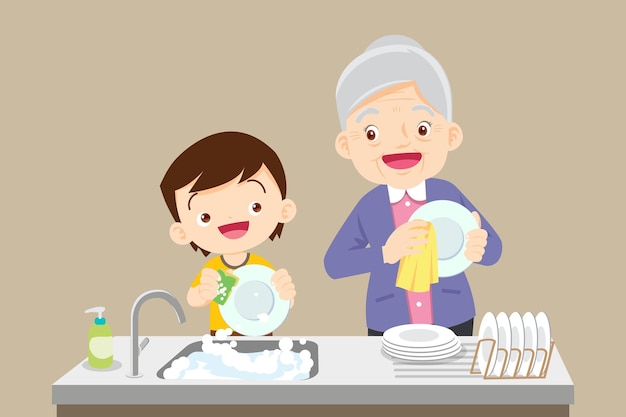 Cute little boy washing dish with grandmother