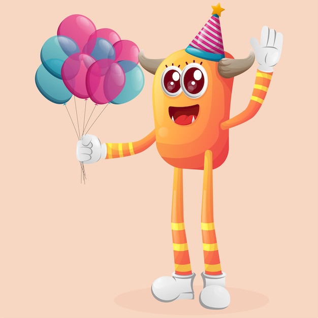 Cute orange monster wearing a birthday hat holding balloons