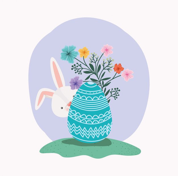 Cute rabbit with egg painted and flowers in the garden