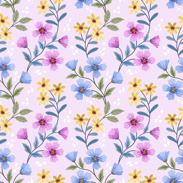 Cute small pink yellow and blue flowers with green leaf seamless pattern.