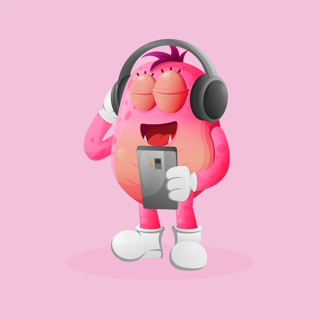 Cute yellow monster listening music on a smartphone using a headphone