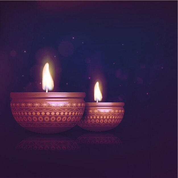 Dark diwali background with two burning candles