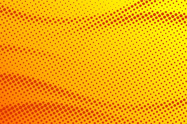 Dotted halftone pattern on yellow orange background Abstract retro pop art texture