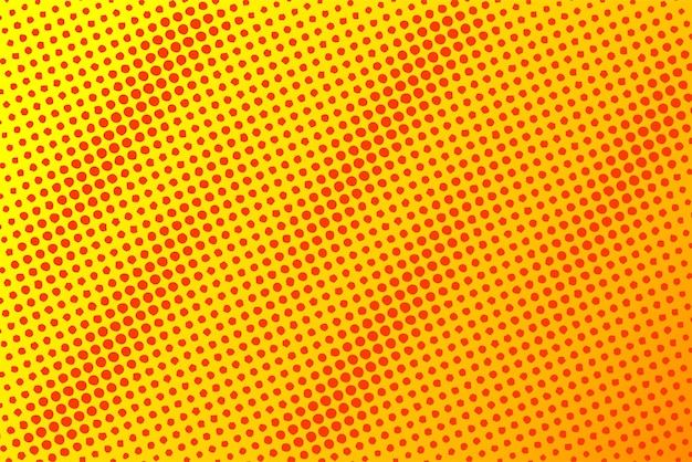 Dotted halftone pattern on yellow orange background Abstract retro pop art texture