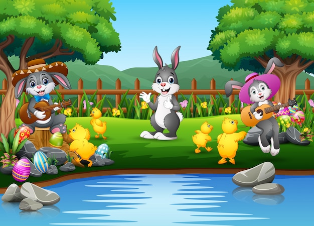 Easter background with bunnies and baby chick on the nature