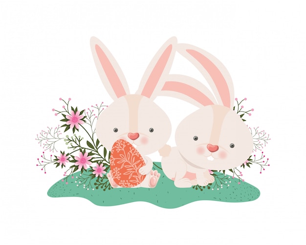 Easter rabbits with egg and flowers