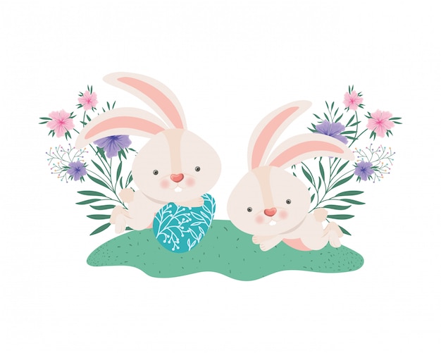 Easter rabbits with egg and flowers