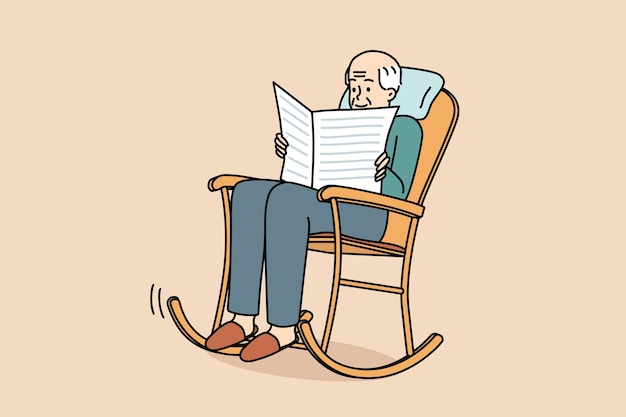 Elderly man sit in chair reading newspaper