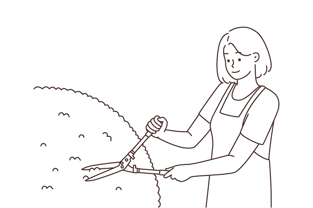 Female gardener cutting bushes