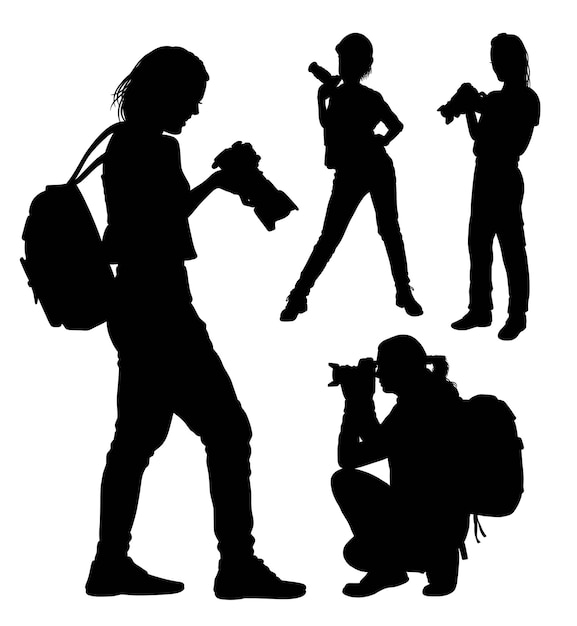 Female photographer with backpack silhouette