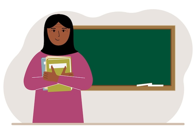 Female teacher with books on the background of the school board